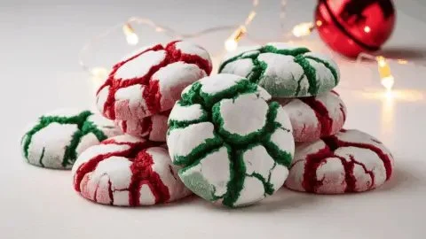 Delicious red and green Christmas Crinkle Cookies dusted with powdered sugar.