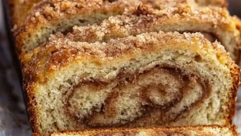 Freshly baked Cinnamon Sugar Bread with a golden crust and cinnamon topping