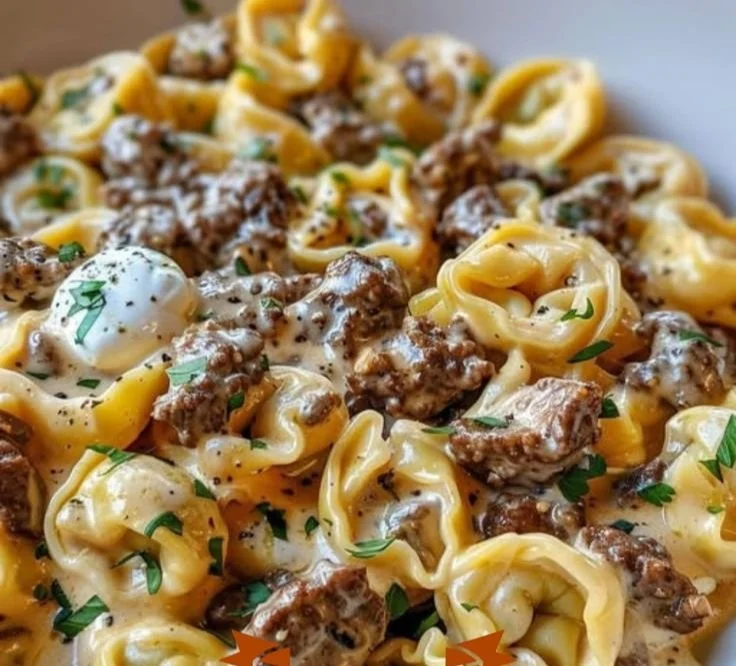 Philly cheesesteak tortellini pasta dish with cheese and peppers