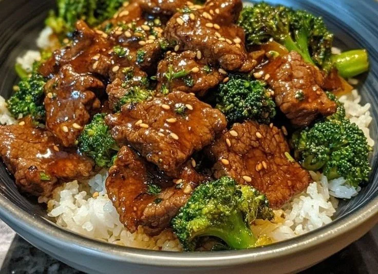 Delicious honey mustard beef broccoli stir fry served in a bowl with chopsticks