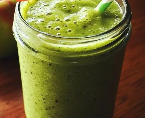 Delicious Green Apple Energy Smoothie served in a glass with fresh ingredients
