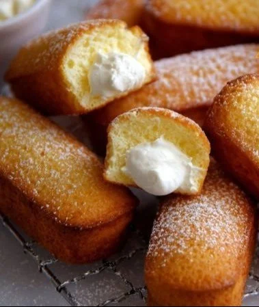 Delicious Homemade Twinkies served on a plate with cream filling